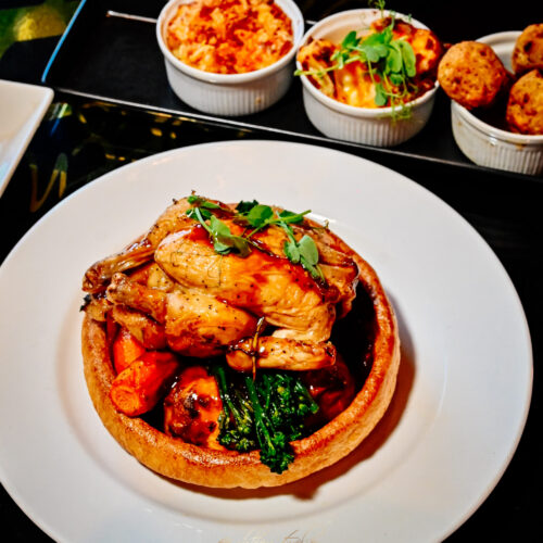 Roast chicken Sunday roast with Yorkshire pudding, vegetables and sides at 1812 Lounge Bar Bournemouth