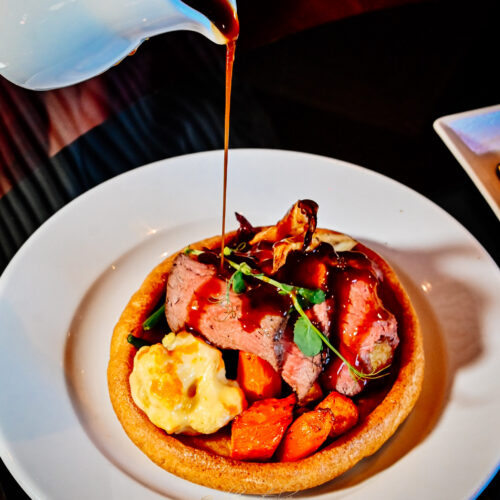 Roast beef Sunday roast with Yorkshire pudding, roast potatoes and vegetables at 1812 Lounge Bar Bournemouth
